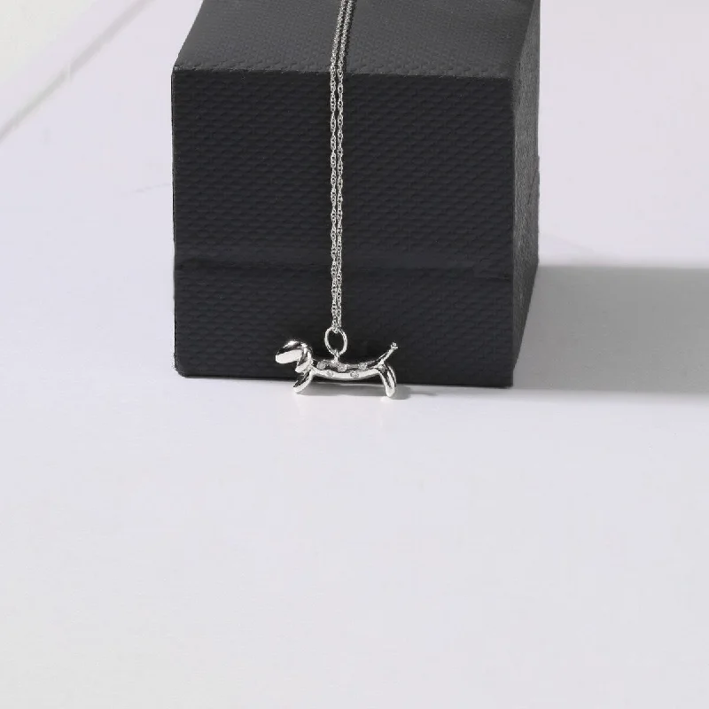 Baroque pearl necklaces-1/20ct TDW Diamond Animal Dachshund Dog Pendant Necklace in Sterling Silver